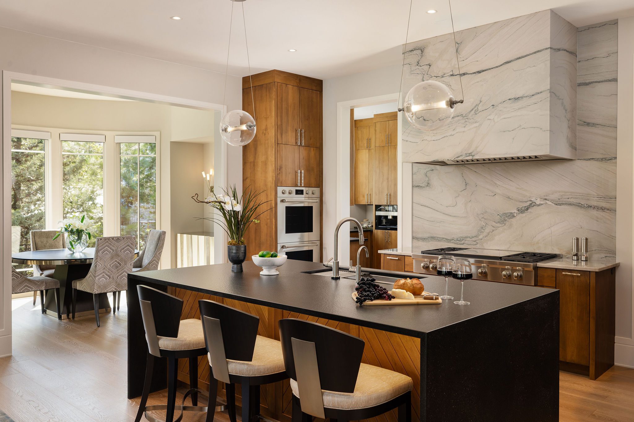 Luxury kitchen with marble backsplash and custom cabinetry Gabriel Builders
