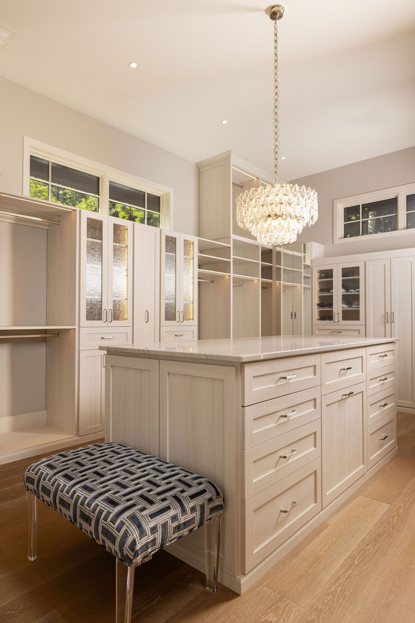 Luxury walk-in closet with chandelier Gabriel Builders custom home