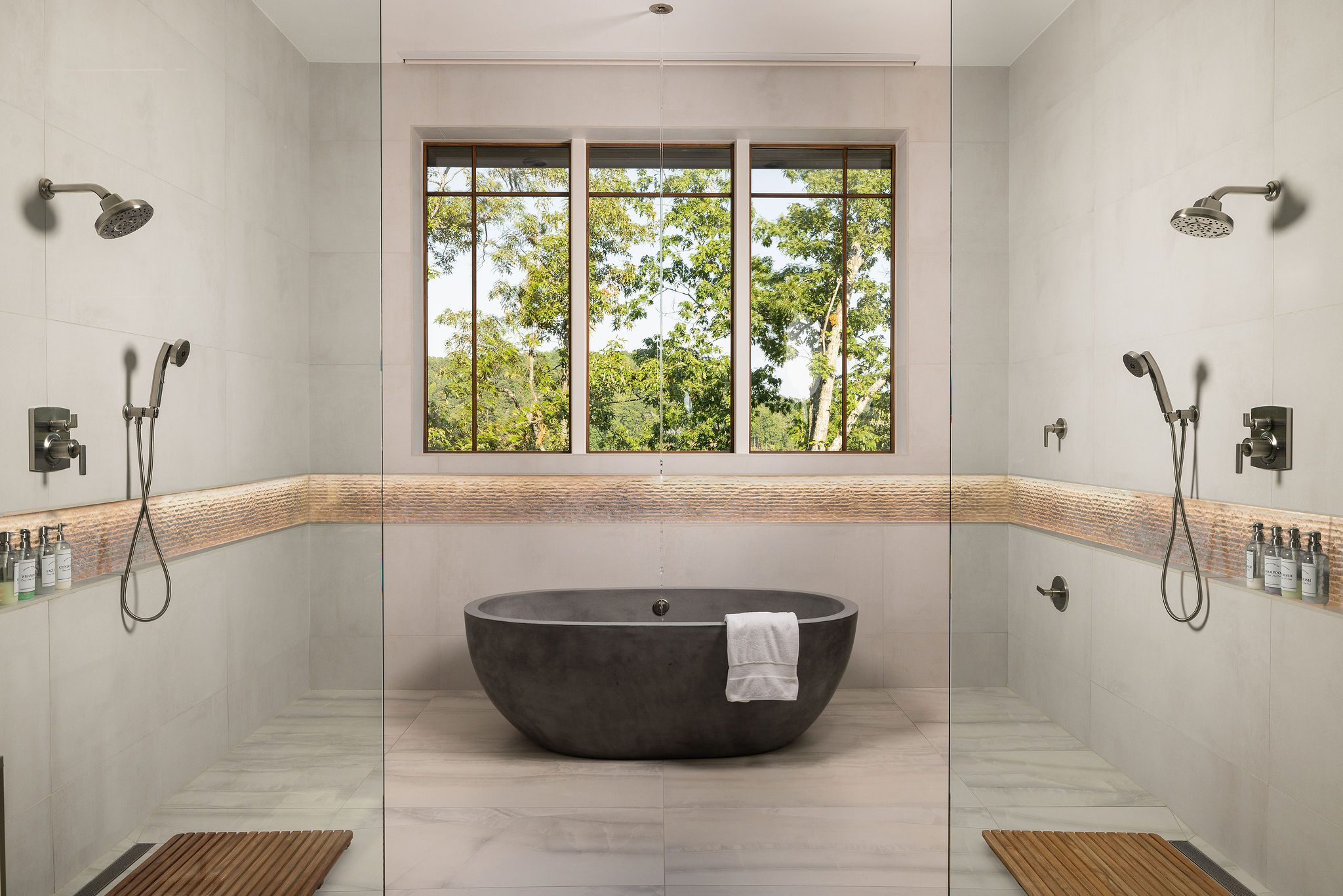 Luxury spa bathroom with soaking tub and double shower Gabriel Builders