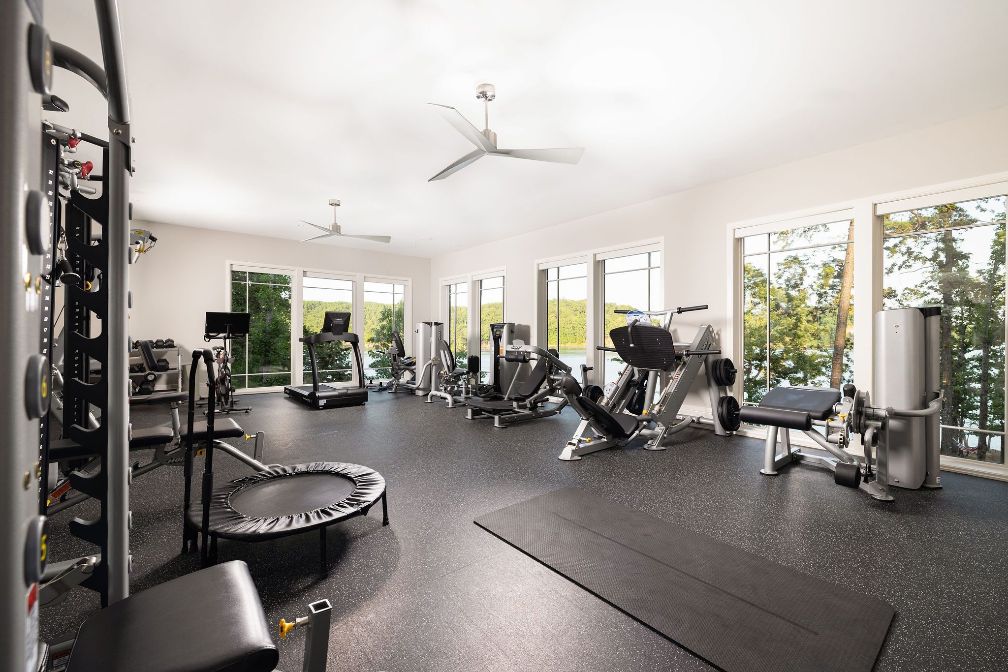 Luxury home gym with lake views Gabriel Builders