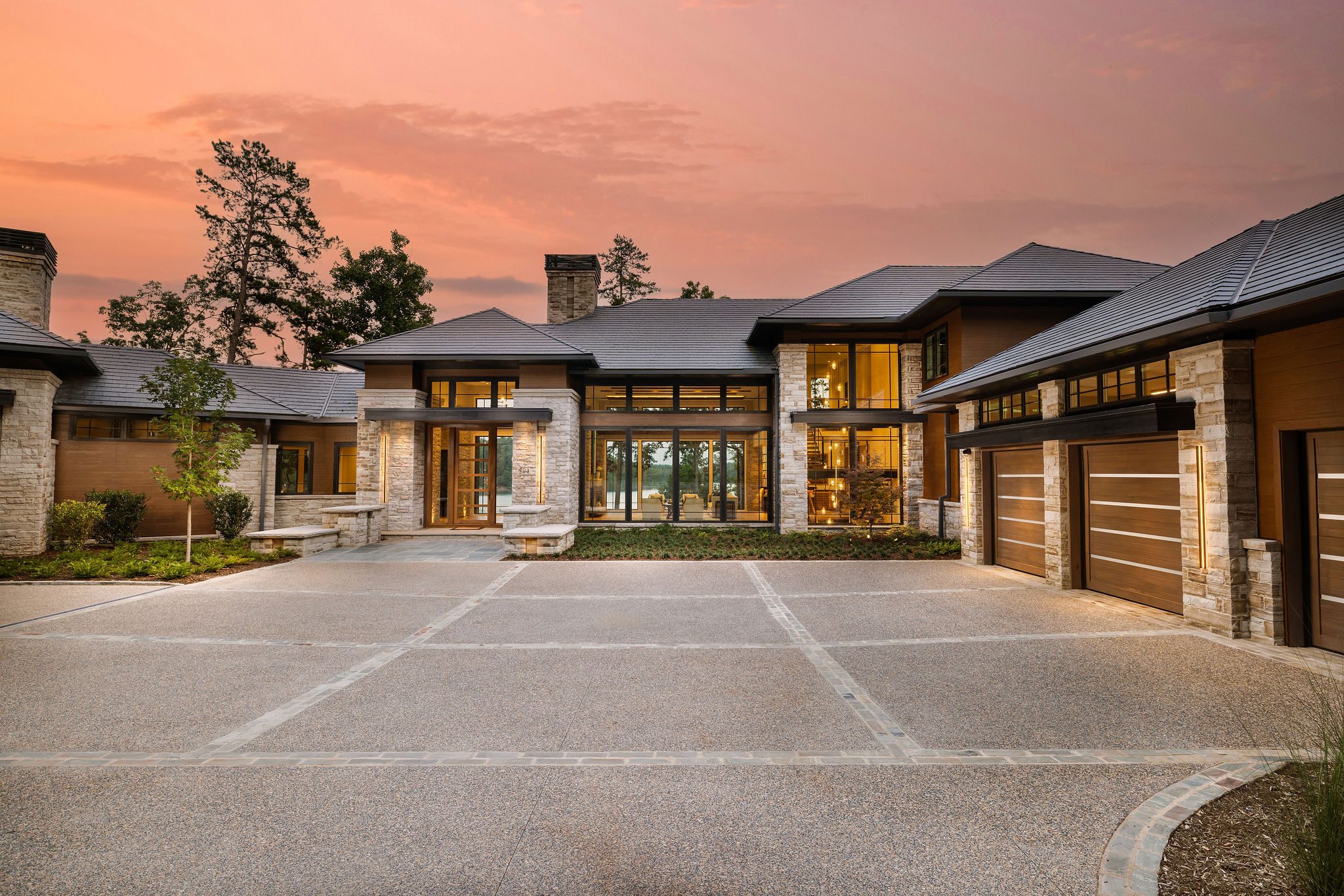 Gabriel Builders custom home front entry courtyard at dusk