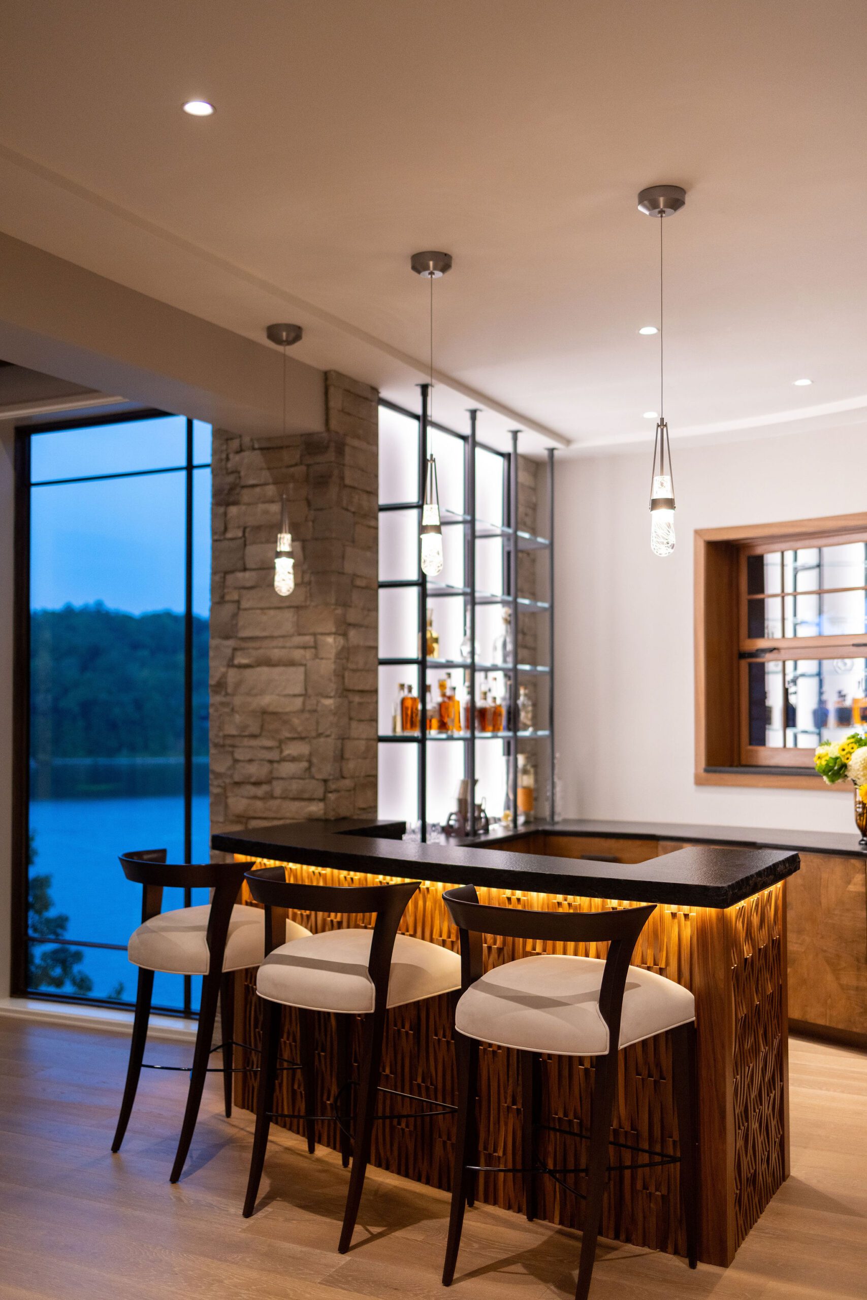Custom wet bar with lake views in Gabriel Builders luxury home