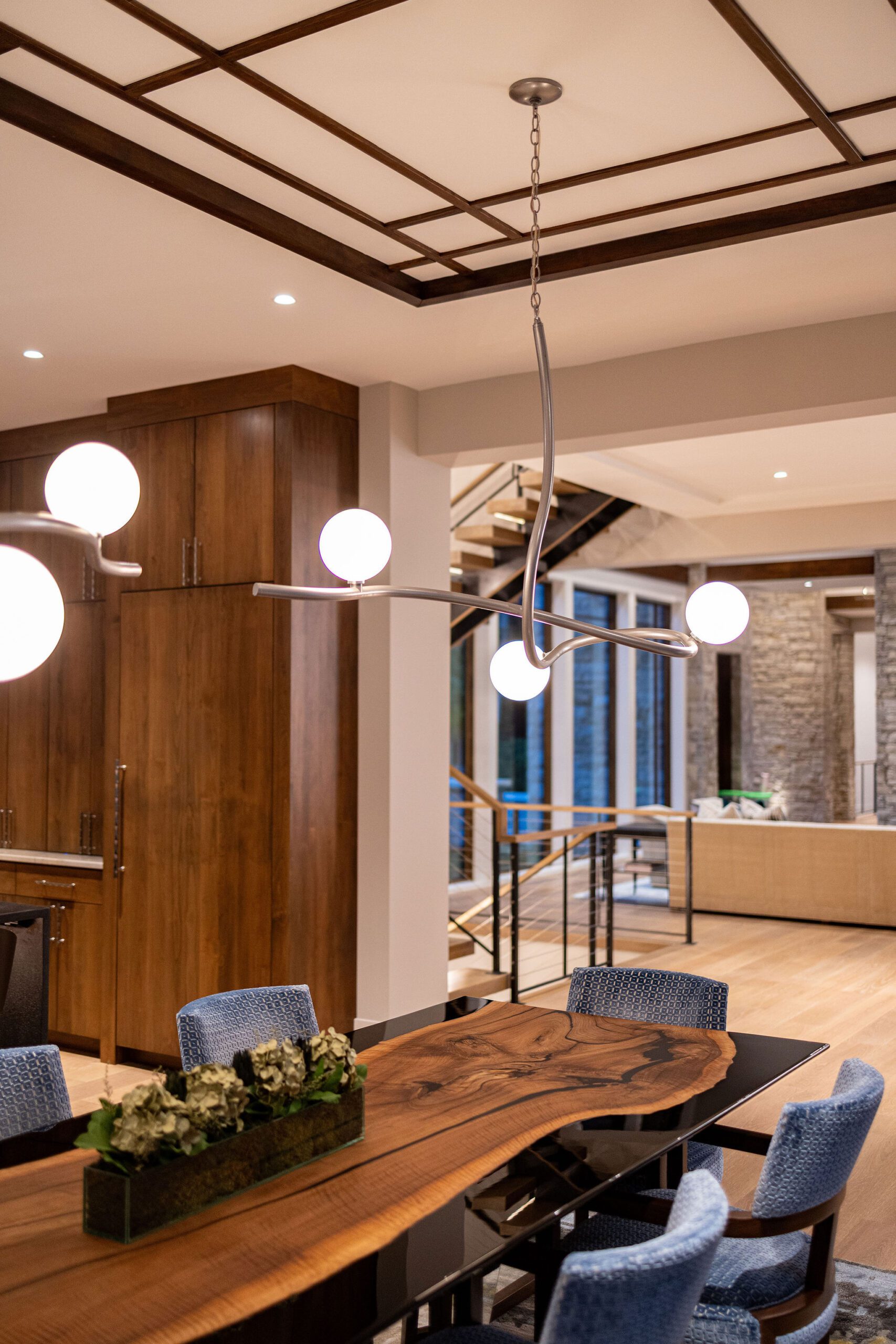 Luxury dining room with live-edge wood table Gabriel Builders home