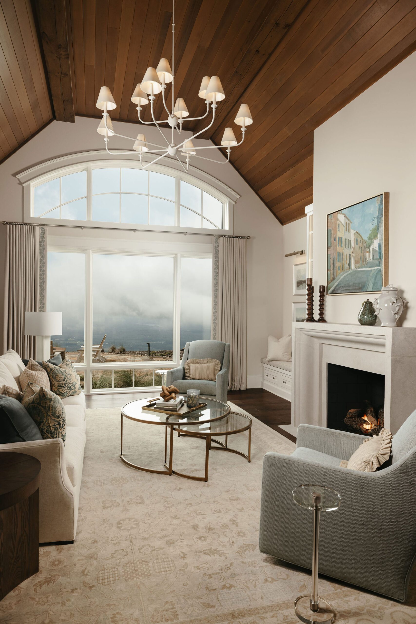 Vaulted ceiling living room with trusses and mountain views