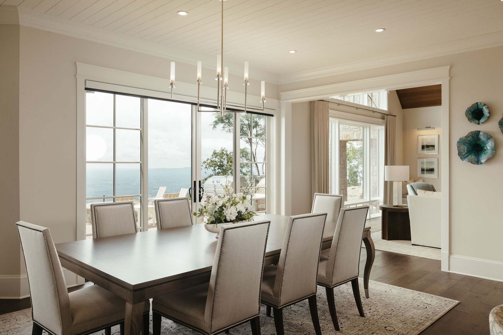 Dining room with panoramic mountain views and chandelier