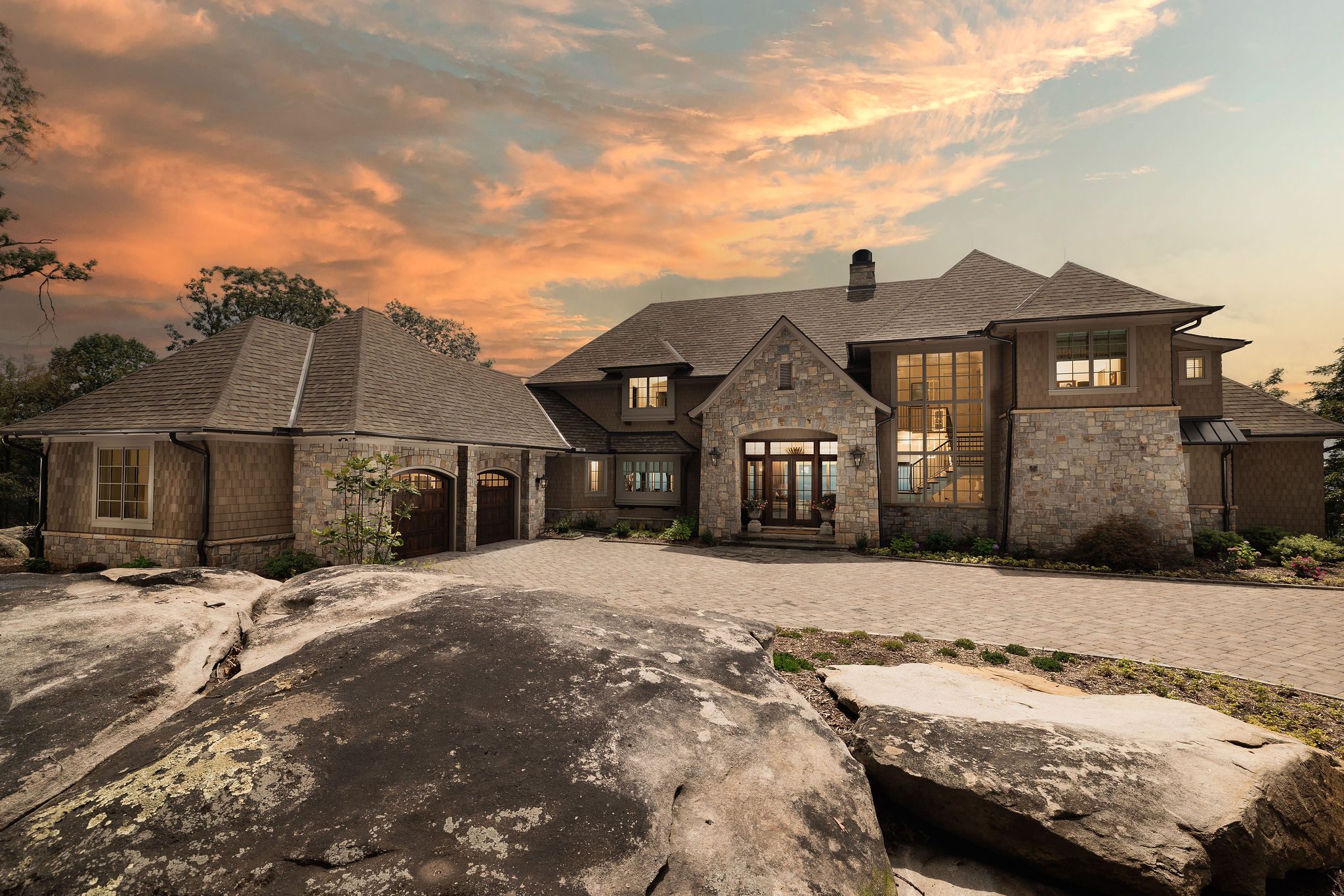 Custom mountain retreat exterior with stone and shake roof at Highview Haven