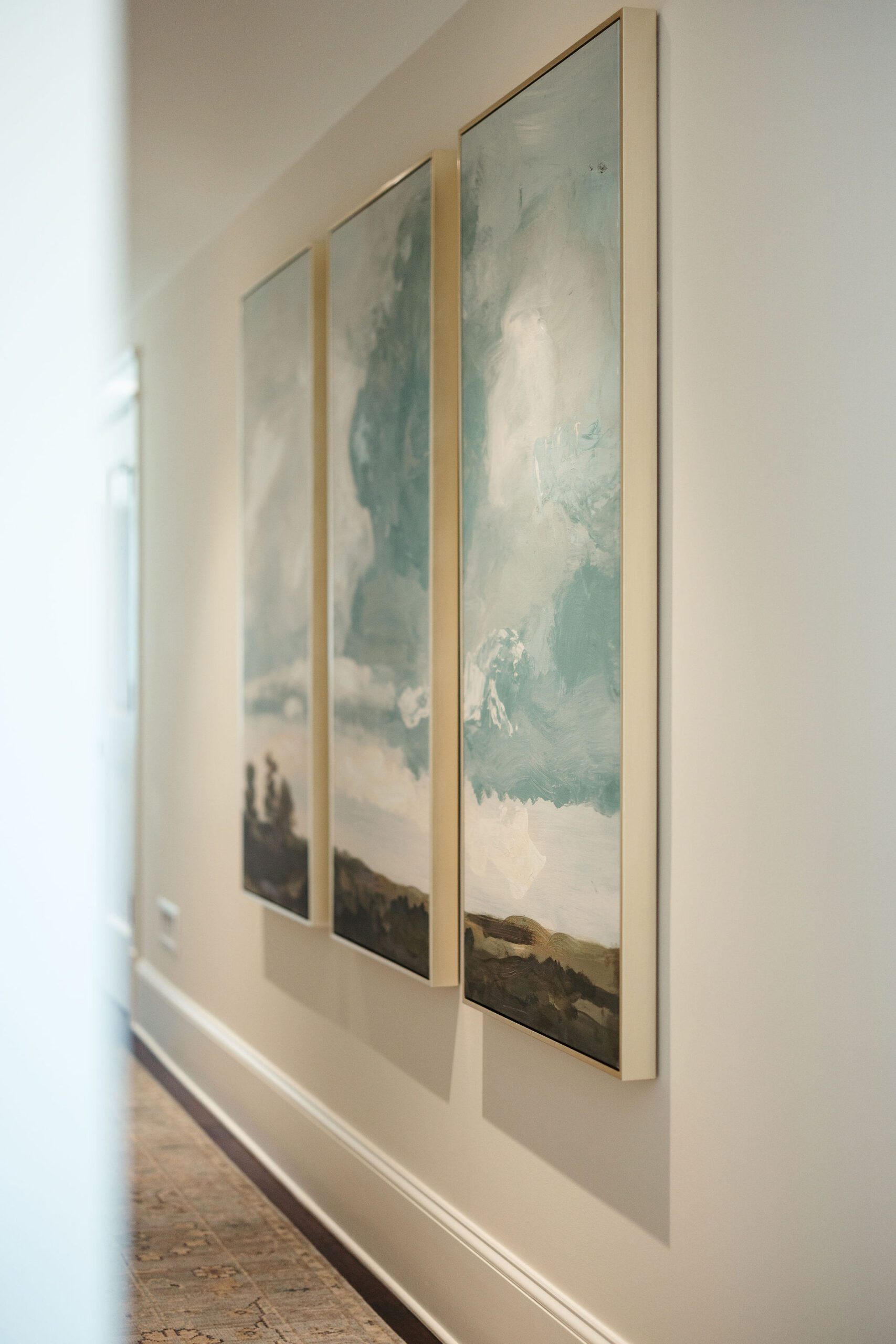 Modern artwork displayed in bright hallway